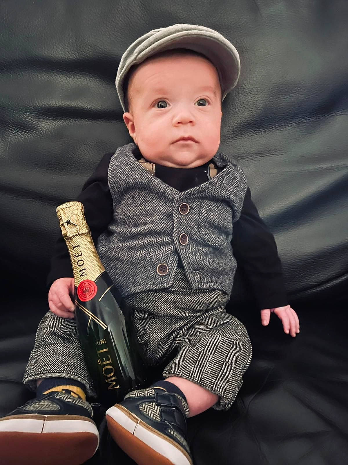 Tyler participe au concours pour gagner de l'argent avec cette photo : baby, baby_toddler_clothing, cap, carmine, collar, design, fashion_accessory, hat, headwear, human_leg, knee, musical_instrument, outerwear, pattern, person, product, sitting, sleeve, textile, thigh