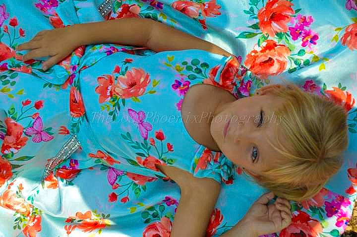 Kaylee is registered to the contest to win money with this photo: baby_toddler_clothing, beauty, blue, botany, child, flower, grass, happy, leisure, magenta, pattern, people_in_nature, person, petal, pink, plant, t_shirt, textile, toddler, tree