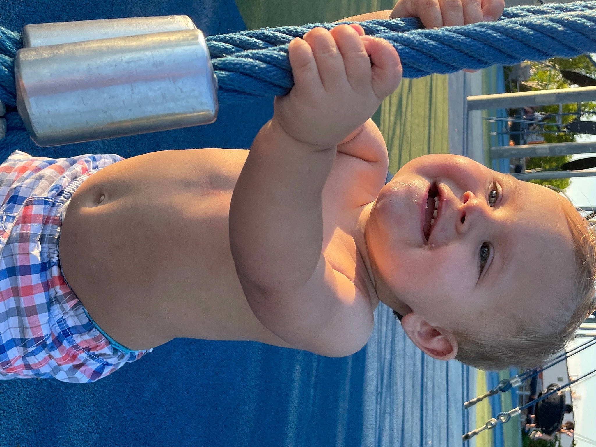 Elikai is registered to the contest to win money with this photo: arm, blue, chest, cool, elbow, eyelash, finger, glasses, hand, human_body, joint, joy, knee, leisure, muscle, neck, person, photograph, plant, shoulder