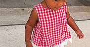 Nova is registered to the contest to win money with this photo: child, concrete, curly_hair, cute, earrings, fashion, girl, headscarf, innocence, outdoor, person, portrait, red_and_white_checkered_dress, shoes, sidewalk, summer, sunlight, toddler, walking, young_child