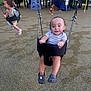 child, toddler, swing, playground, slide, outdoor, fun, happy, play, person, clothing, shoes, smile, park, daylight, recreation, activity, friends, equipment, background