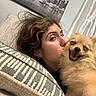 Sapphire is registered to the contest to win money with this photo: person, dog, pomeranian, pet, couch, pillow, indoor, smile, happy, affection, love, fur, face, hair, hand, curtain, wall_art, relaxation, home, portrait