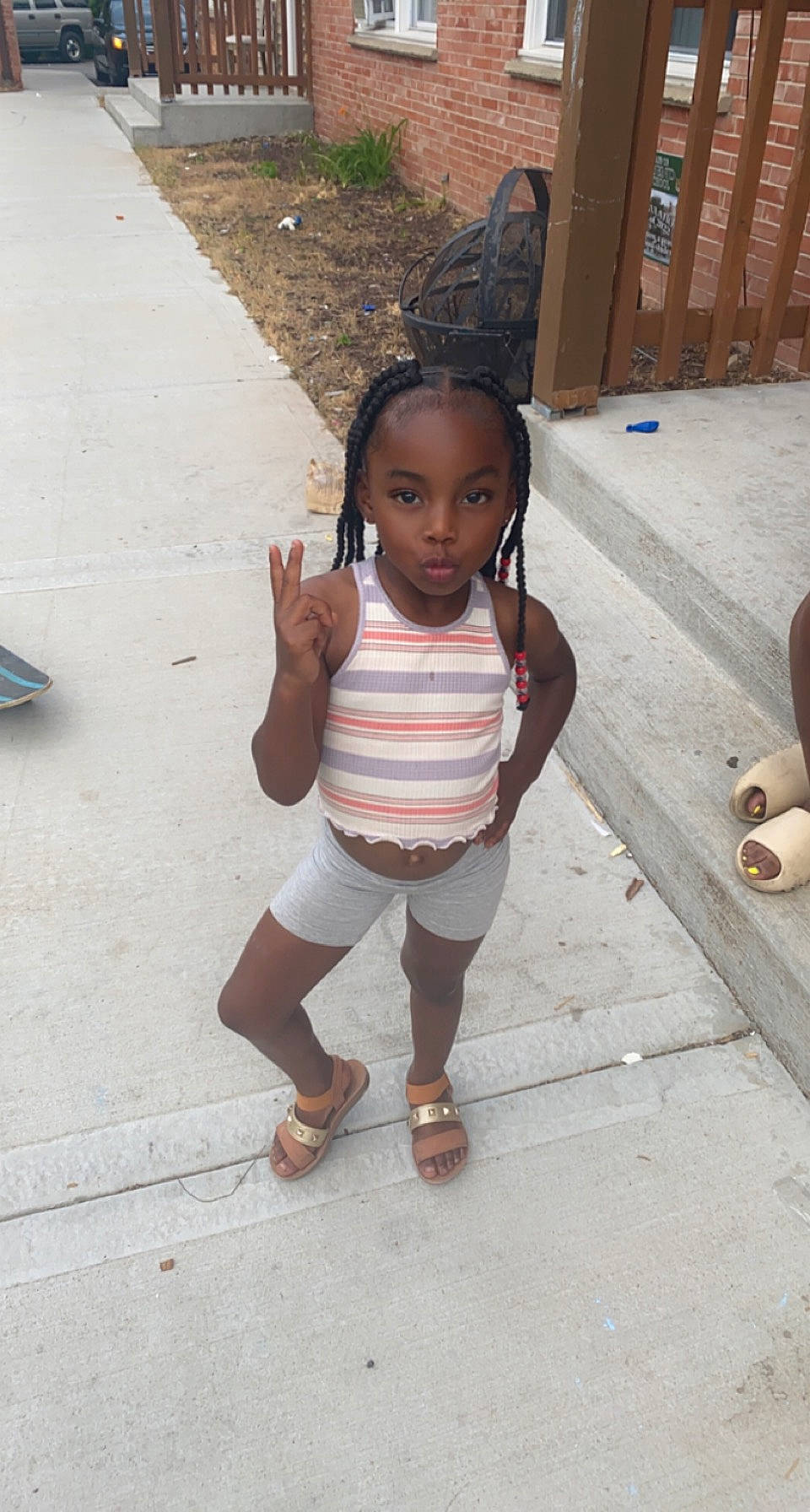 Skye joined the competition — help win amazing prizes! baby_toddler_clothing, black_hair, child, flip_flops, foot, fun, happy, head, human_leg, leisure, person, road_surface, sandal, shoe, sidewalk, sitting, skin, t_shirt, thigh, toddler