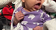 Alani joined the competition — help win amazing prizes! baby, blanket, child, clothing, comfort, cozy, cute, cute_expression, face, hand, infant, lying_down, newborn, purple_onesie, resting, skin, sleepwear, soft, tongue_out, unicorn_pattern
