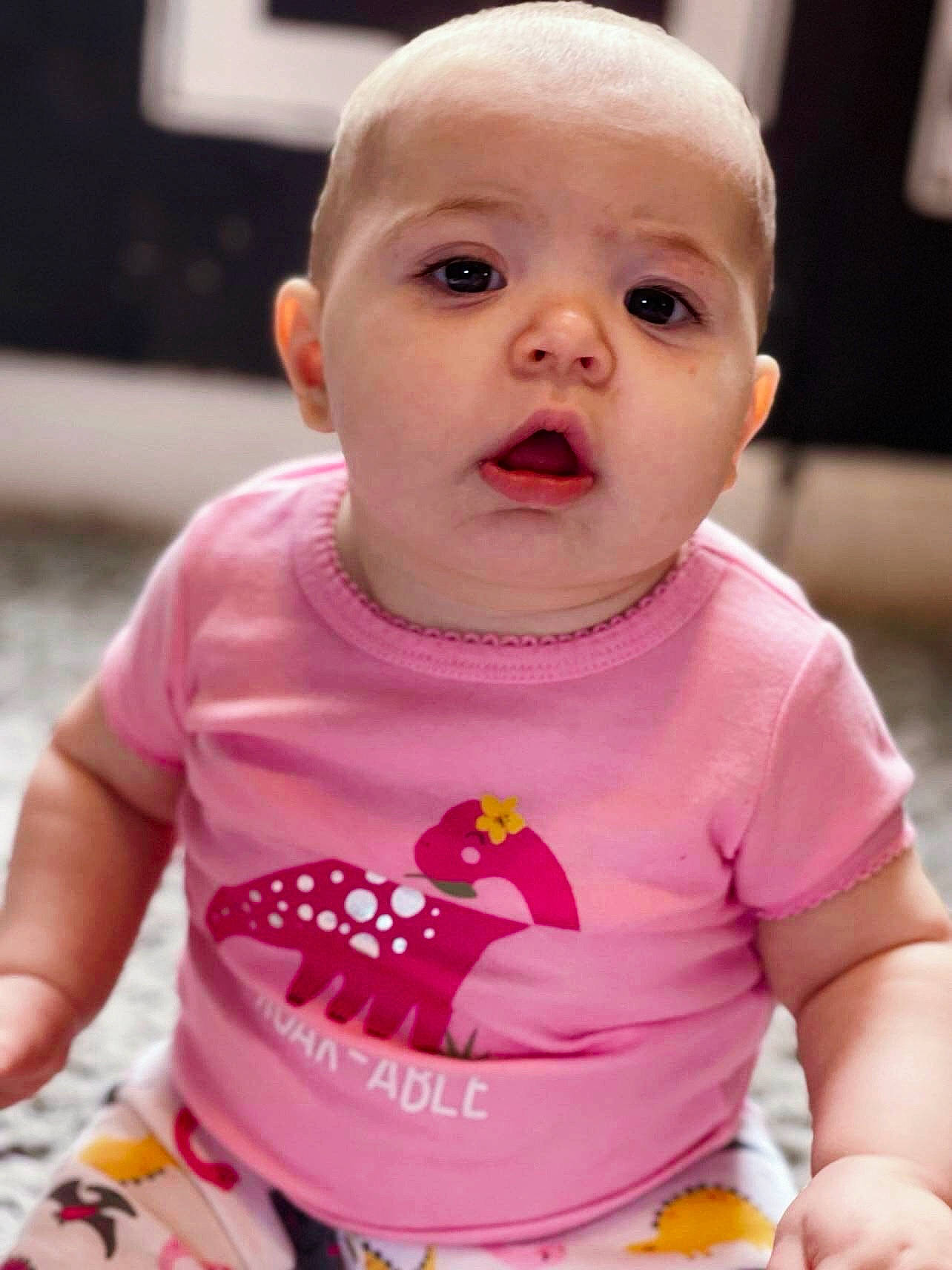 Lilly-mae is registered to the contest to win money with this photo: baby, baby_toddler_clothing, cheek, chin, clothing, eyelash, facial_expression, happy, head, human_body, iris, lip, mouth, neck, nose, person, pink, product, skin, sleeve