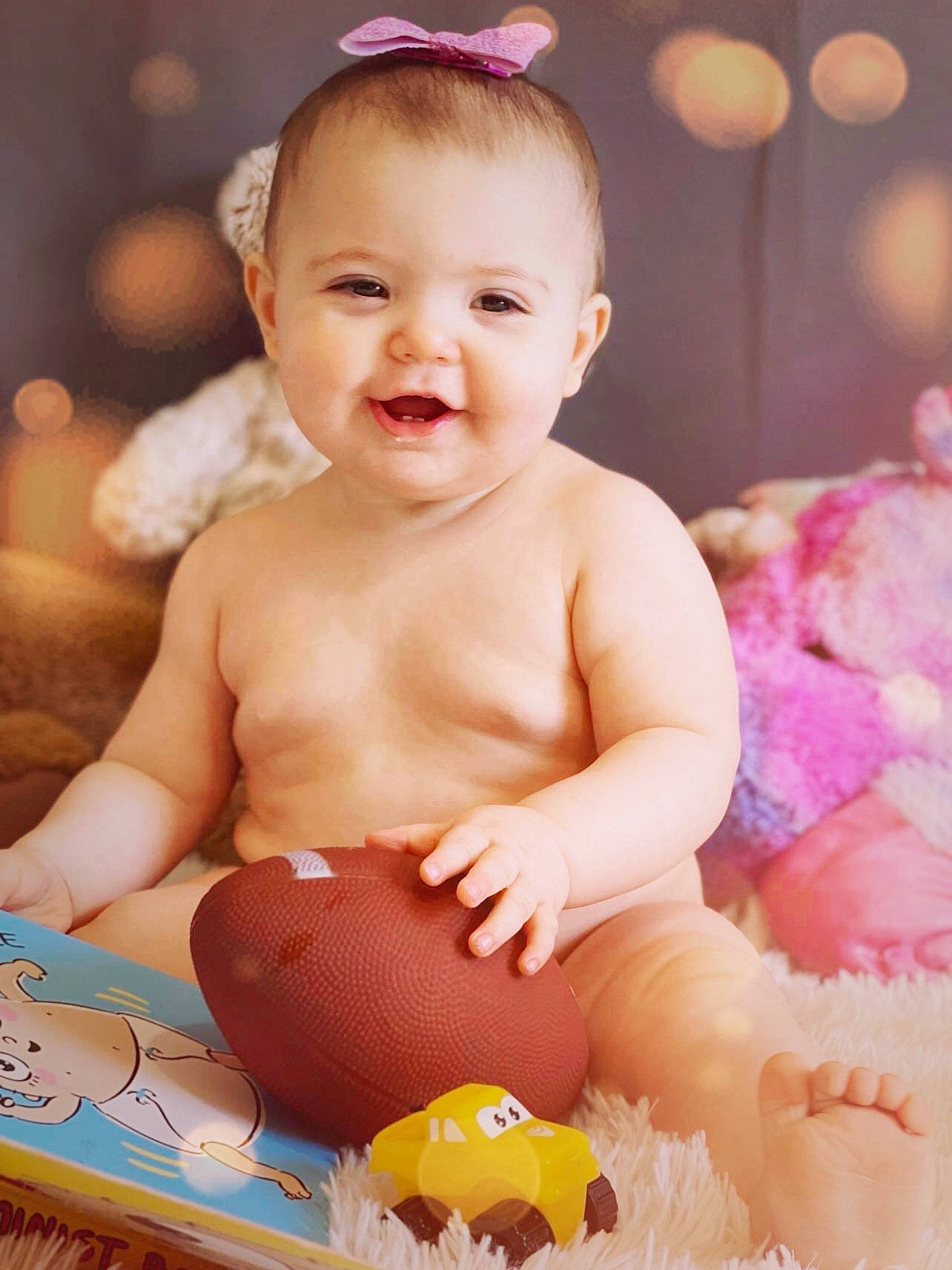 Lilly-mae is registered to the contest to win money with this photo: baby, baby_playing_with_toys, baby_toddler_clothing, cheek, child, eye, face, facial_expression, finger, flash_photography, fun, happy, head, joy, person, photograph, pink, playing_with_kids, skin, smile