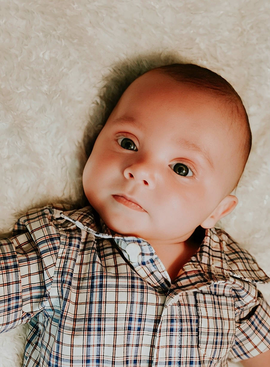 Cooper is registered to the contest to win money with this photo: baby, baby_toddler_clothing, cheek, child, chin, collar, dress_shirt, eyelash, flash_photography, happy, iris, lip, nose, person, plaid, skin, sleeve, tartan, textile, toddler
