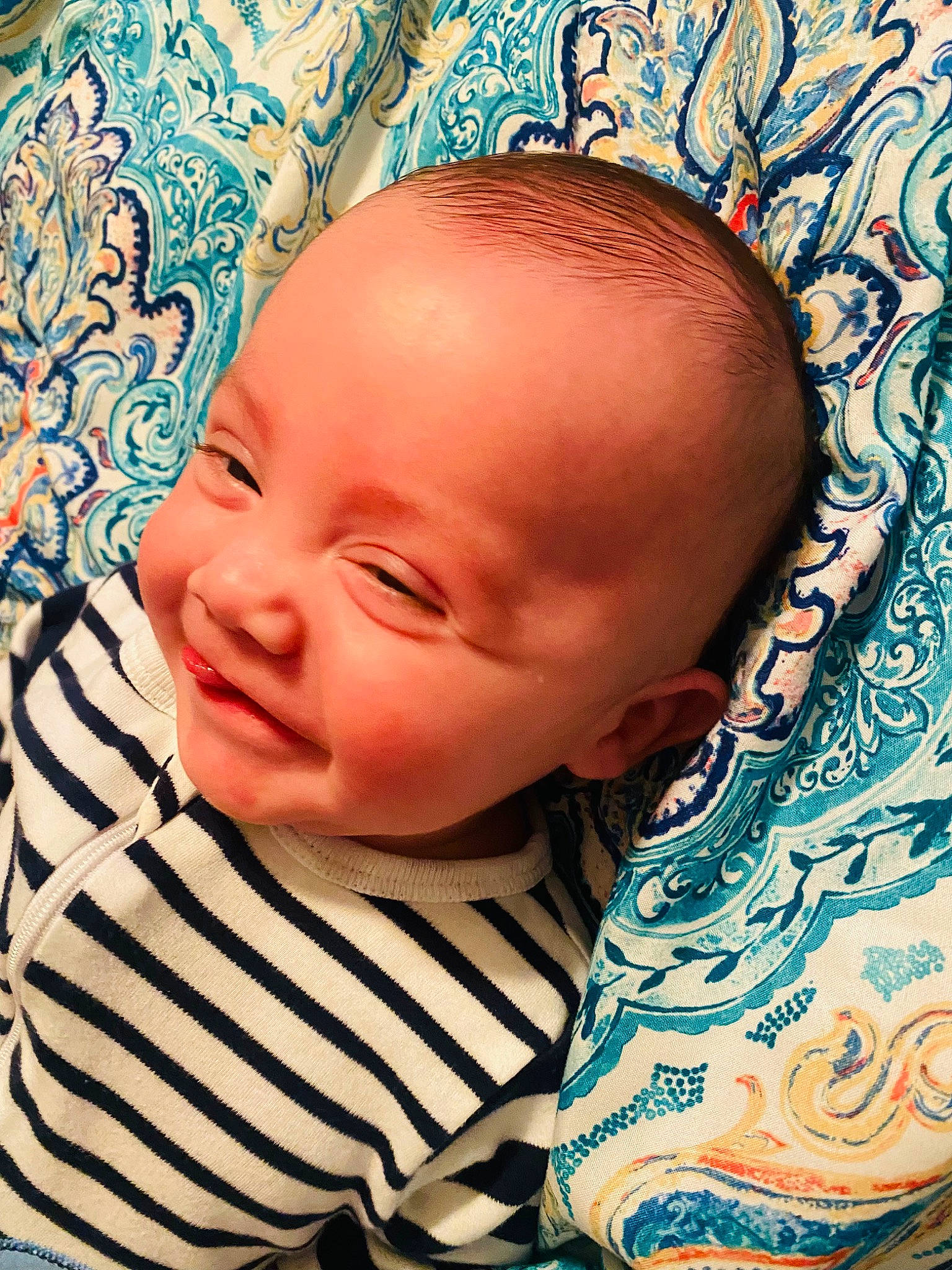 Cooper is registered to the contest to win money with this photo: baby, baby_toddler_clothing, blue, cheek, chin, comfort, cool, eye, eyebrow, eyelash, forehead, hairstyle, happy, iris, mouth, neck, nose, person, skin, textile