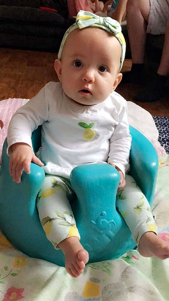 Dolly is registered to the contest to win money with this photo: baby, baby_toddler_clothing, child, person, product, sitting, toddler