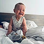 baby, bed, blanket, child, cozy, cute, elephant_toy, happy, home, indoor, infant, person, plush_toy, portrait, sleepwear, smiling, soft_light, toddler, white_clothing, wooden_headboard
