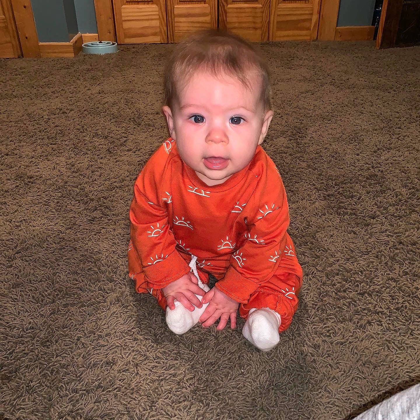 Trypp is registered to the contest to win money with this photo: baby, baby_toddler_clothing, cabinetry, cheek, child, comfort, crawling, cupboard, eye, floor, flooring, hardwood, head, nose, person, room, sleeve, standing, toddler, varnish