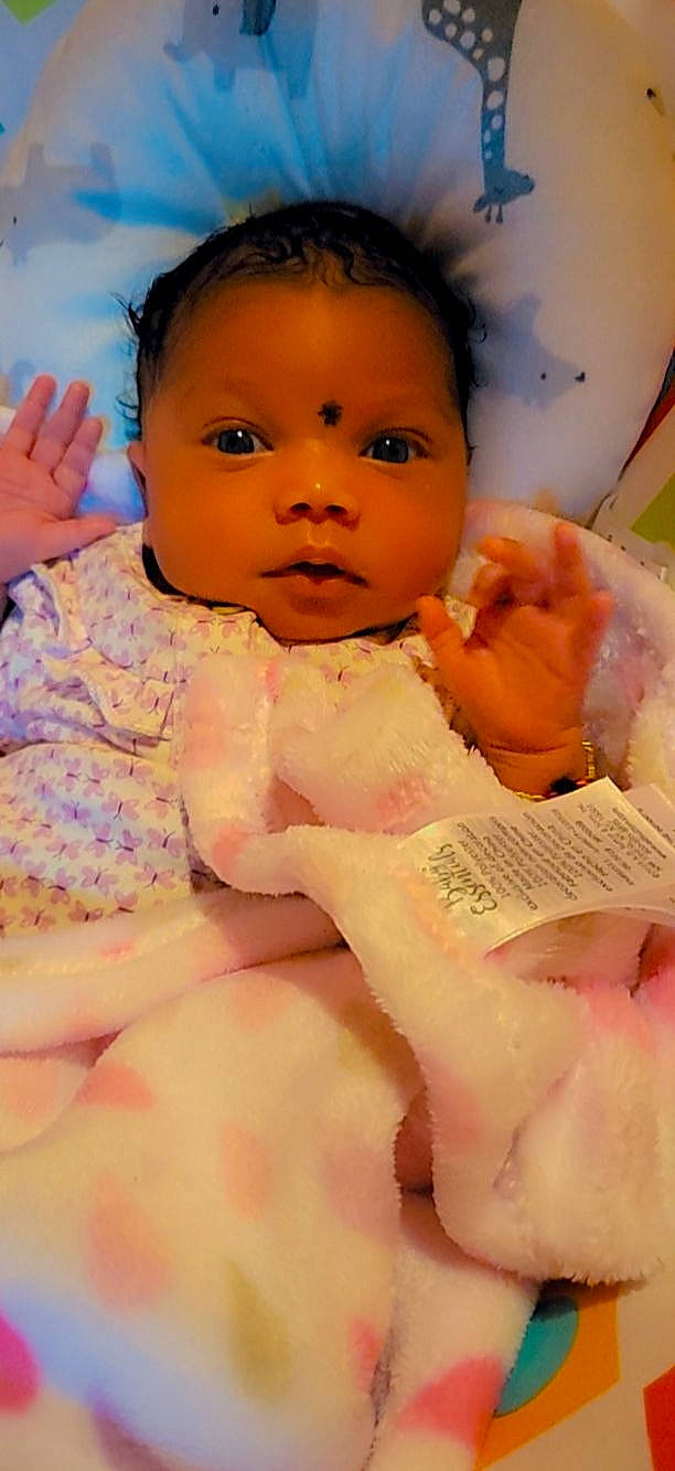 Marisol is registered to the contest to win money with this photo: arm, baby, baby_toddler_clothing, cheek, chin, eye, eyebrow, eyelash, face, happy, head, iris, lip, mouth, nail, neck, nose, person, pink, skin