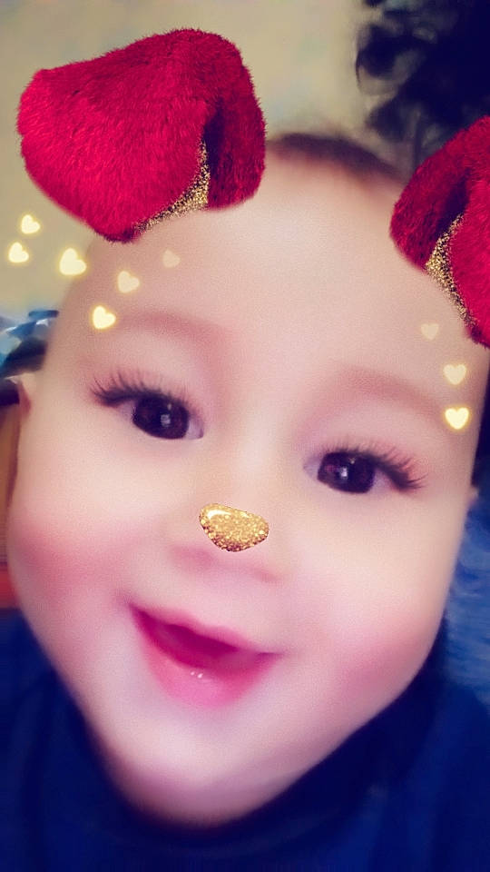 Levi is registered to the contest to win money with this photo: cheek, chin, doll, ear, eye, eyebrow, eyelash, forehead, hair, hairstyle, happy, head, iris, joy, lip, nose, person, purple, skin, smile