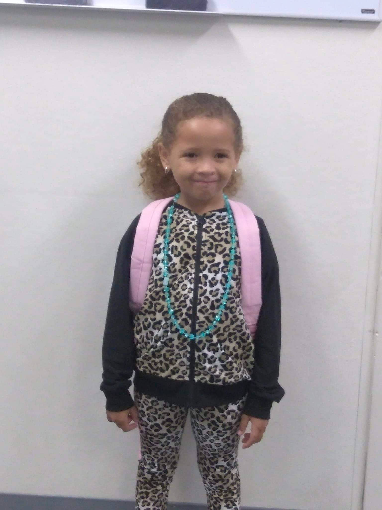 Jazmyn is registered to the contest to win money with this photo: child, clothing, day, design, fashion, girl, joy, outerwear, pattern, person, pink, product, standing, sweater, textile, toddler, top