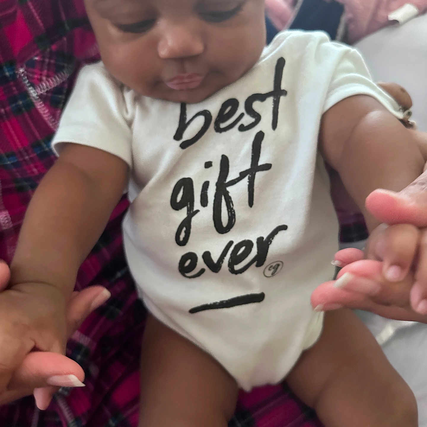 Nova joined the competition — help win amazing prizes! baby, babylaughing, bodypart, clothing, face, finger, hand, happy, head, number, person, photography, portrait, sitting, sleeve, stain, symbol, t_shirt, text, writing