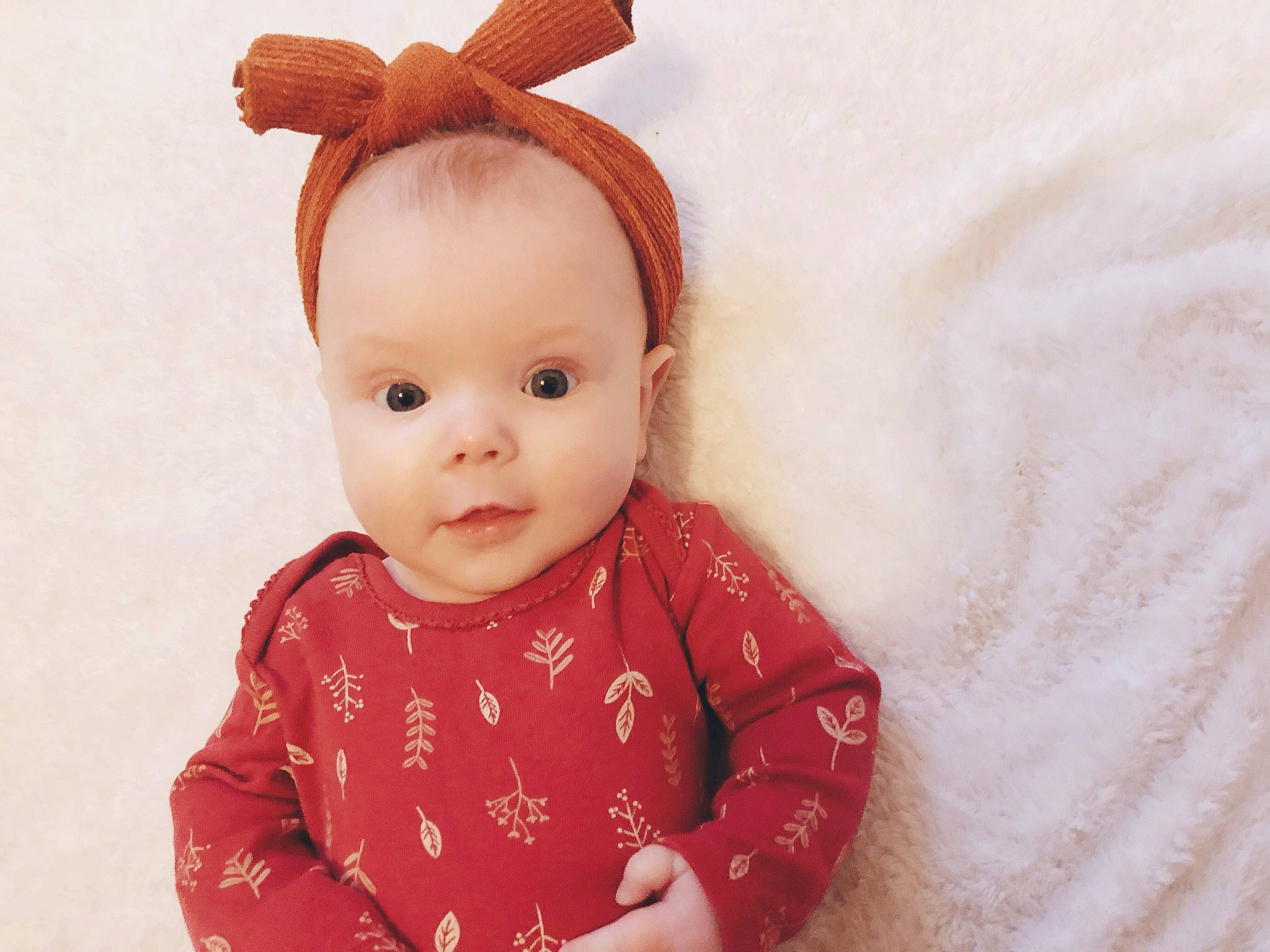 Althea is registered to the contest to win money with this photo: baby, baby_toddler_clothing, brown_hair, cheek, child, doll, ear, face, fawn, hair_accessory, head, headband, lip, organ, person, pink, skin, stuffed_toy, textile, toddler