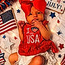 Brylee is registered to the contest to win money with this photo: baby, infant, red_bow, usa, american_flag, 4th_of_july, holiday, festive, stars, lights, blanket, cute, patriotic, celebration, dress, white_lace, portrait, indoors, adorable, holiday_decor