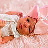 Brylee is registered to the contest to win money with this photo: baby, infant, pink_bow, fluffy_blanket, white_dress, cute, portrait, newborn, soft_texture, headwear, child, lying_down, adorable, face, skin, small_hand, closeup, indoors, peaceful, expression