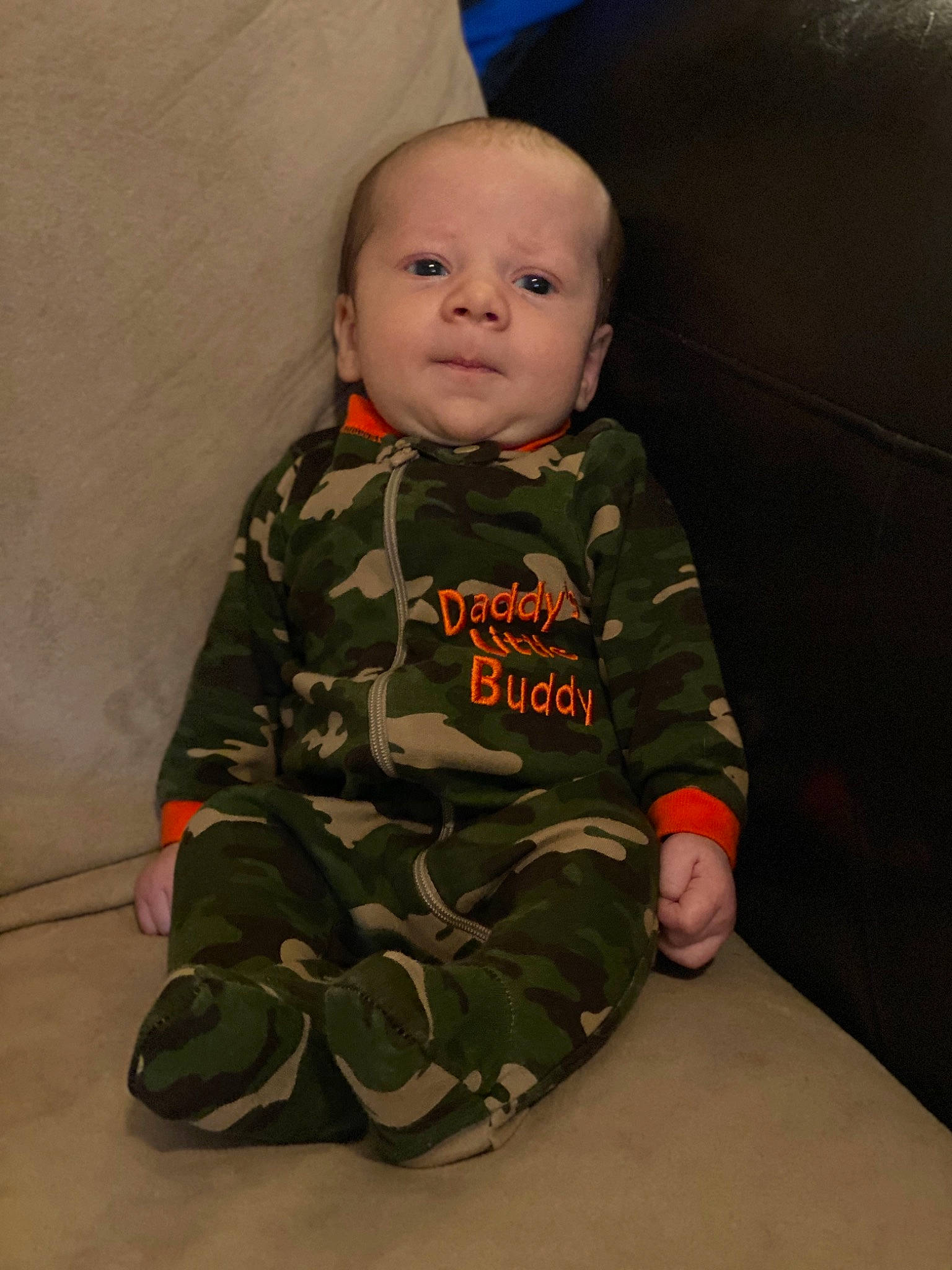 Abel is registered to the contest to win money with this photo: baby, camouflage, child, design, head, military_camouflage, military_uniform, pattern, person, sitting, sleeve, soldier, toddler