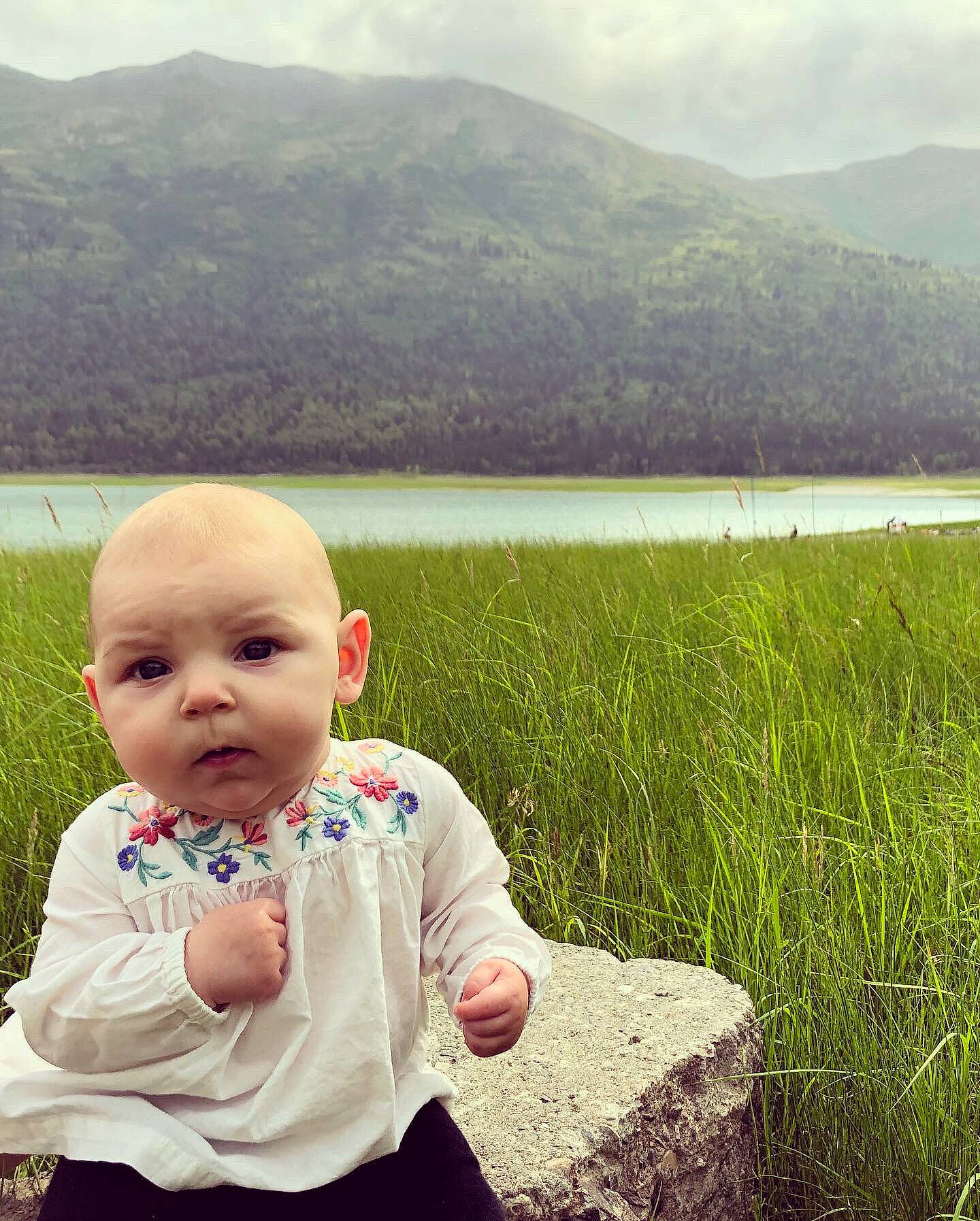 Aryanna joined the competition — help win amazing prizes! beauty, cheek, child, cloud, eye, grass, grass_family, green, happy, lake, mountain, mountainous_landforms, people_in_nature, person, skin, sky, summer, toddler, vacation, water