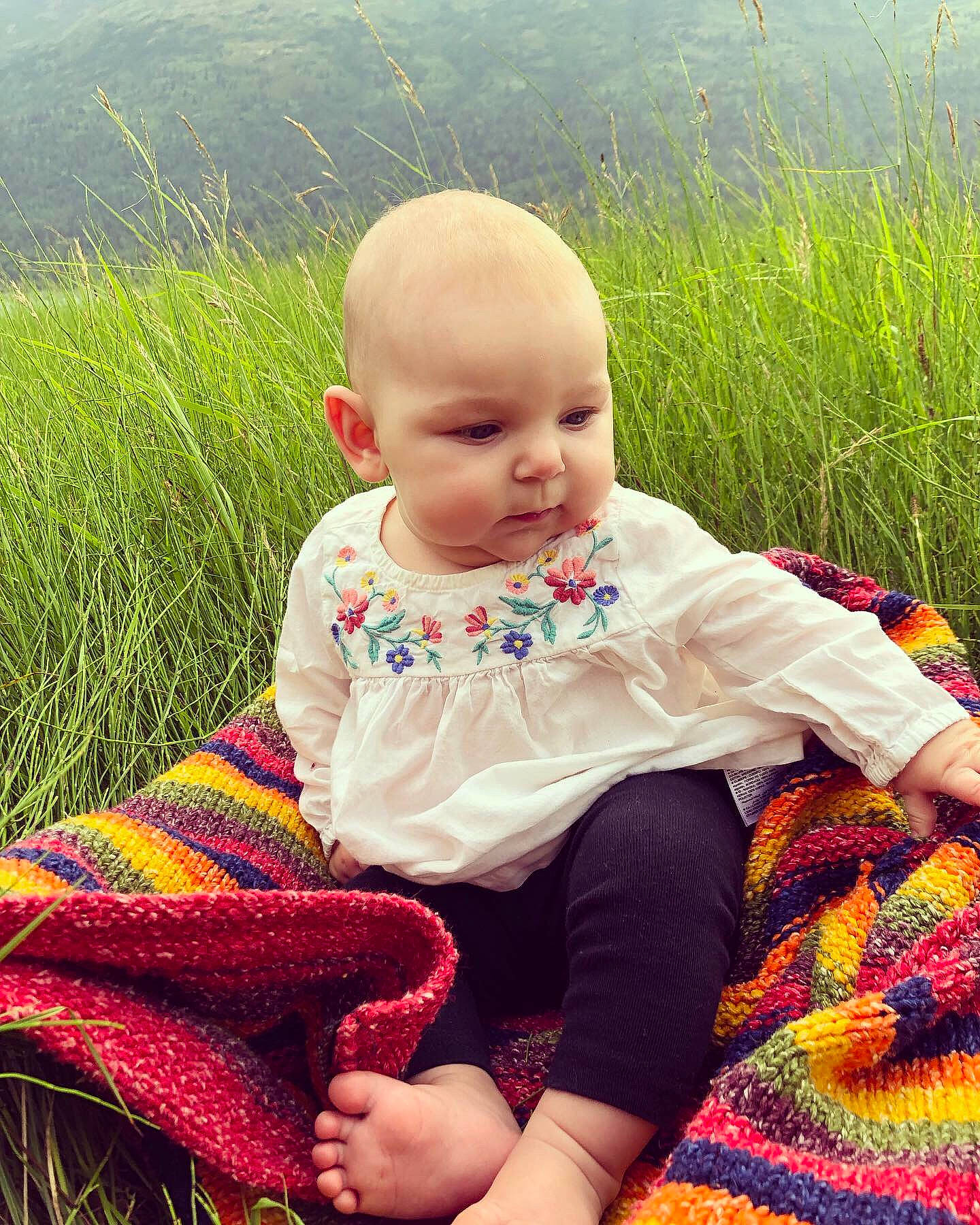 Aryanna joined the competition — help win amazing prizes! adaptation, baby, cheek, child, cool, crochet, dress, face, grass, grass_family, knitting, leaf, pattern, person, plant, sitting, skin, smile, summer, toddler