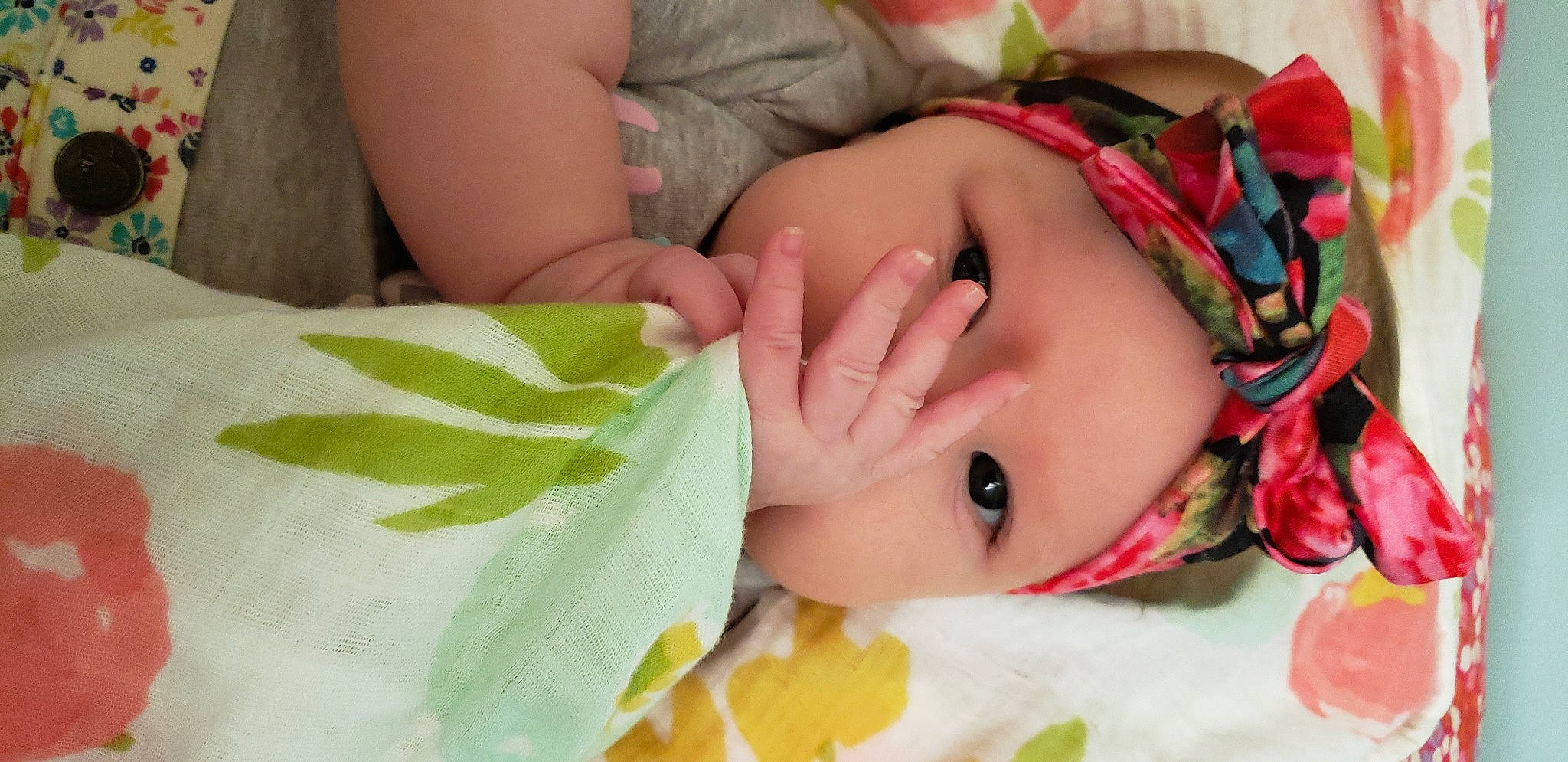 Emily joined the competition — help win amazing prizes! baby, baby_products, baby_sleeping, baby_toddler_clothing, child, comfort, fashion_accessory, finger, hand, happy, headwear, linens, nail, pattern, person, rose, skin, textile, thumb, toddler