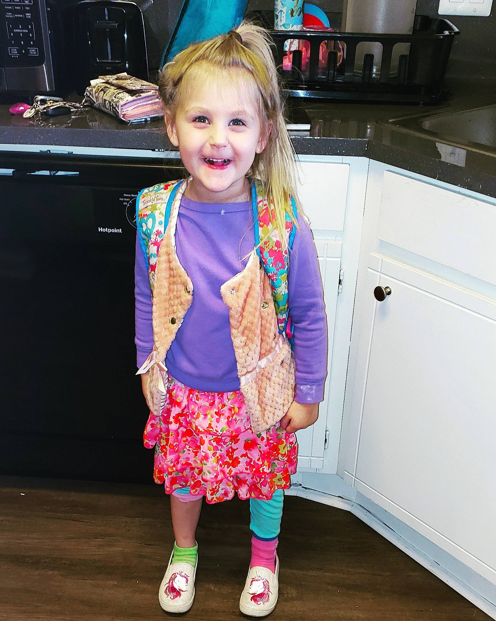 Jacqueline is registered to the contest to win money with this photo: baby_toddler_clothing, cabinetry, cooktop, countertop, fun, gas_stove, hairstyle, happy, home_appliance, joint, joy, kitchen, kitchen_appliance, kitchen_stove, microwave_oven, organ, person, pink, sleeve, smile