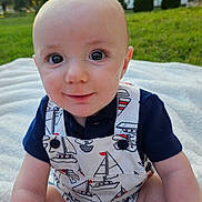 Alden joined the competition — help win amazing prizes! baby, child, smiling, sitting, outdoor, grass, blanket, romper, clothing, face, eyes, cute, garden, sunlight, nature, portrait, happy, infant, person, summer