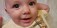 Alden joined the competition — help win amazing prizes! baby, child, smile, face, eyes, shirt, clothing, cartoon, toy_story, woody, buzz_lightyear, infant, closeup, portrait, cute, expression, lying_down, soft_surface, happy, person