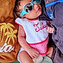 Jaden participe au concours pour gagner de l'argent avec cette photo : baby, infant, sunglasses, bib, socks, clothing, green_chair, reflection, person, relaxing, cute, toddler, diaper, fabric, casual, portrait, indoor, resting, closeup, comfort