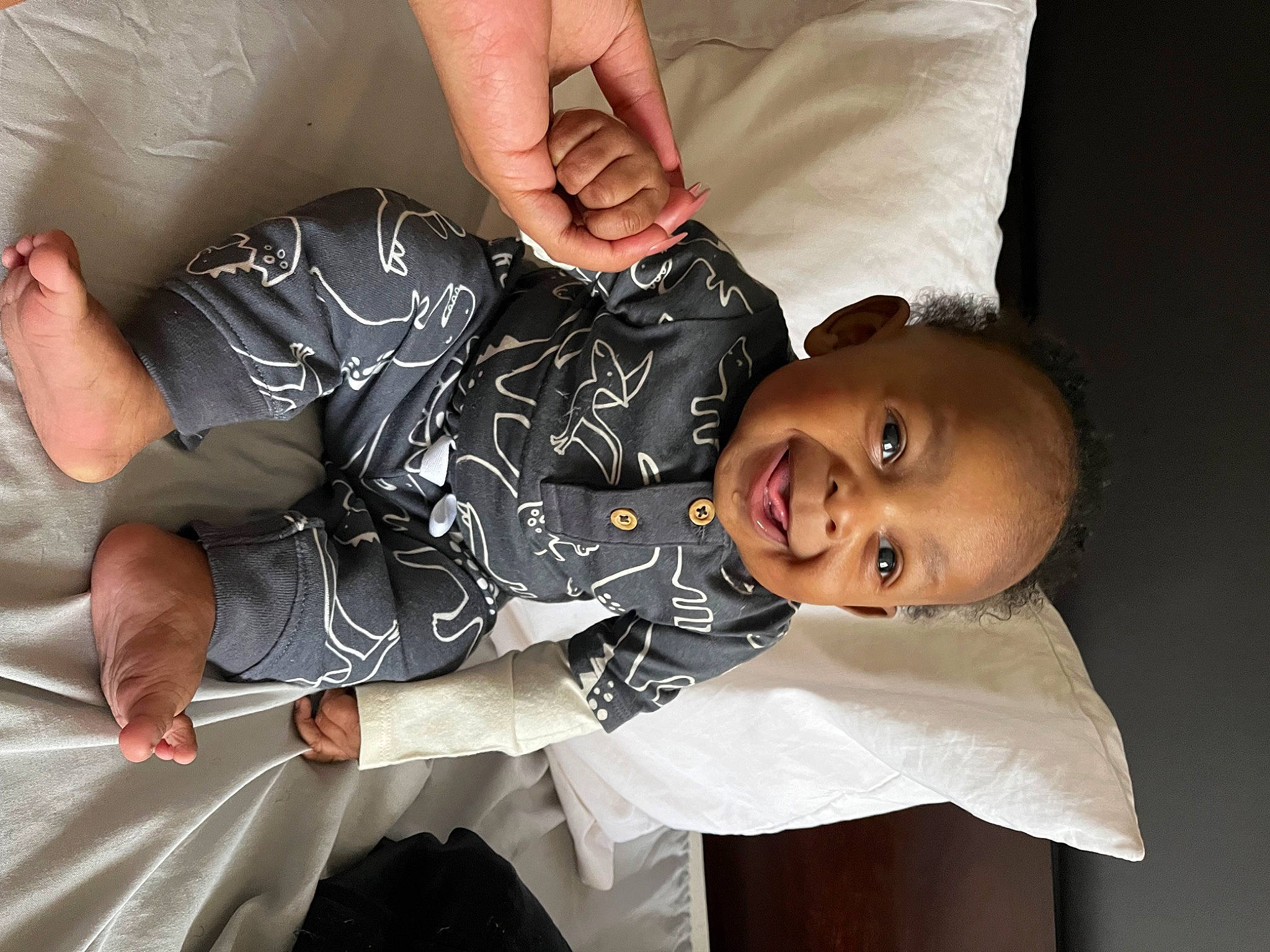 Michael is registered to the contest to win money with this photo: child, comfort, elbow, event, facial_expression, finger, flash_photography, fun, gesture, hand, happy, human_body, human_leg, joy, nail, person, sitting, sleeve, smile, thumb