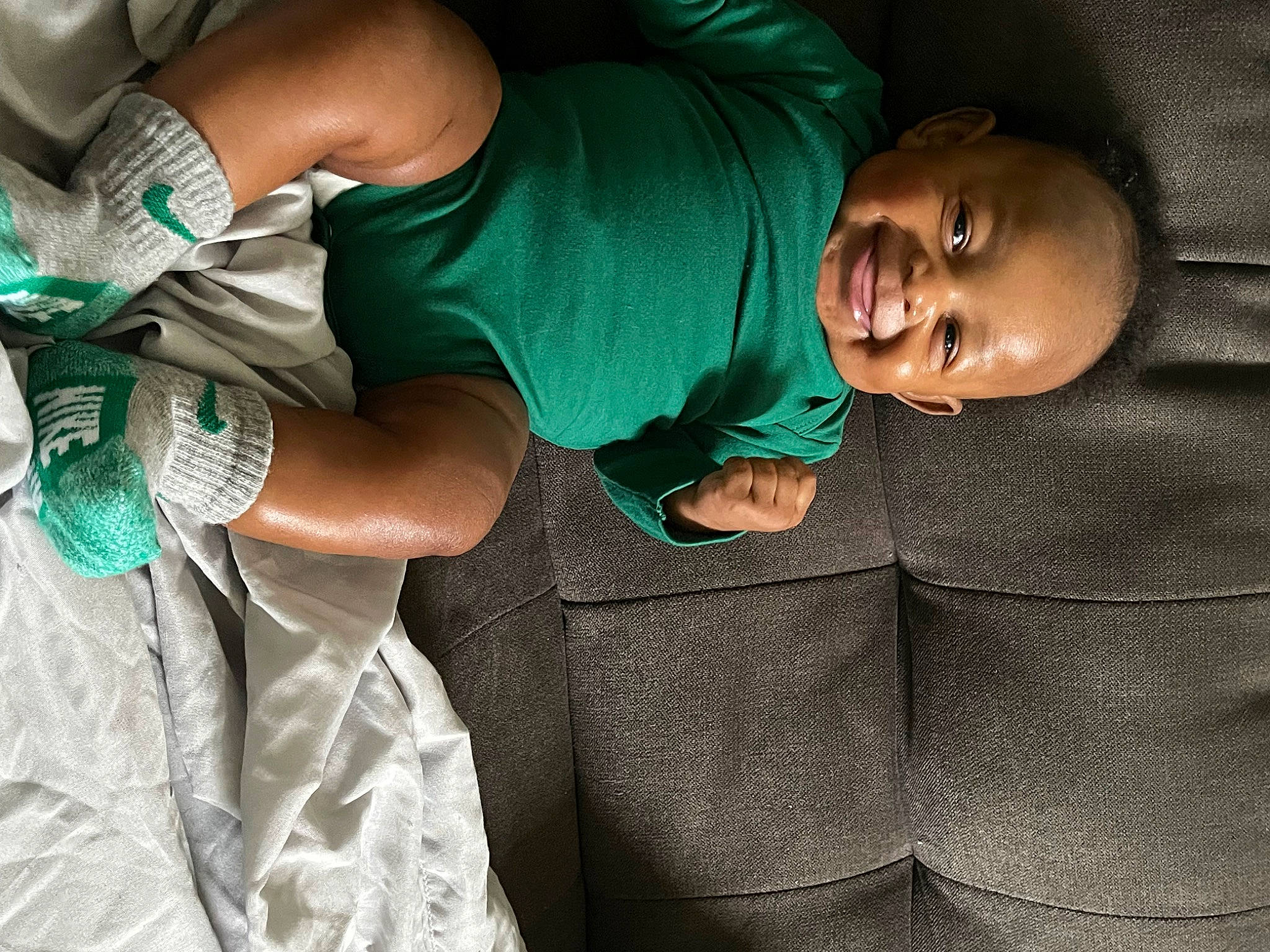 Michael joined the competition — help win amazing prizes! abdomen, baby, car_seat, child, comfort, couch, elbow, fun, glove, green, human_body, human_leg, joy, knee, linens, person, sitting, textile, thigh, toddler