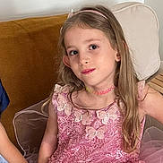 Sofia a rejoint le concours — aidez-le/la à gagner de superbes lots ! child, girl, pink_dress, butterflies, beads, long_hair, headband, smile, couch, cushion, pillow, seated, portrait, indoor, person, fashion, cute, young, happy, pretty