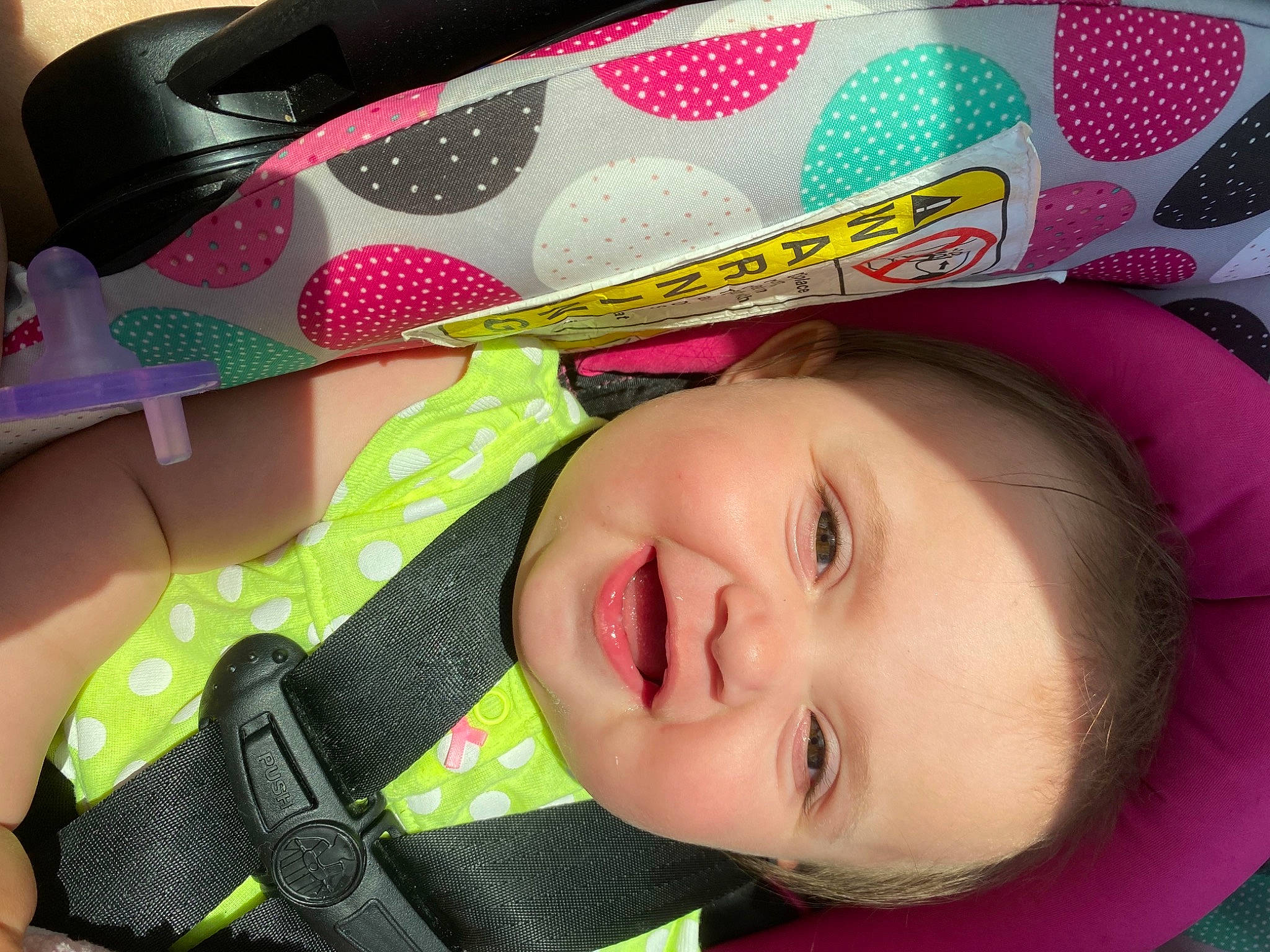 London is registered to the contest to win money with this photo: baby, baby_laughing, baby_toddler_clothing, cheek, child, eyelash, green, happy, iris, lip, material_property, nose, person, pink, red, skin, smile, textile, toddler, white
