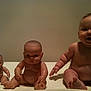 baby, doll, toy, child, naked, sitting, three, skin, face, arm, leg, expression, indoor, table, background, cute, chubby, real, plastic, comparison