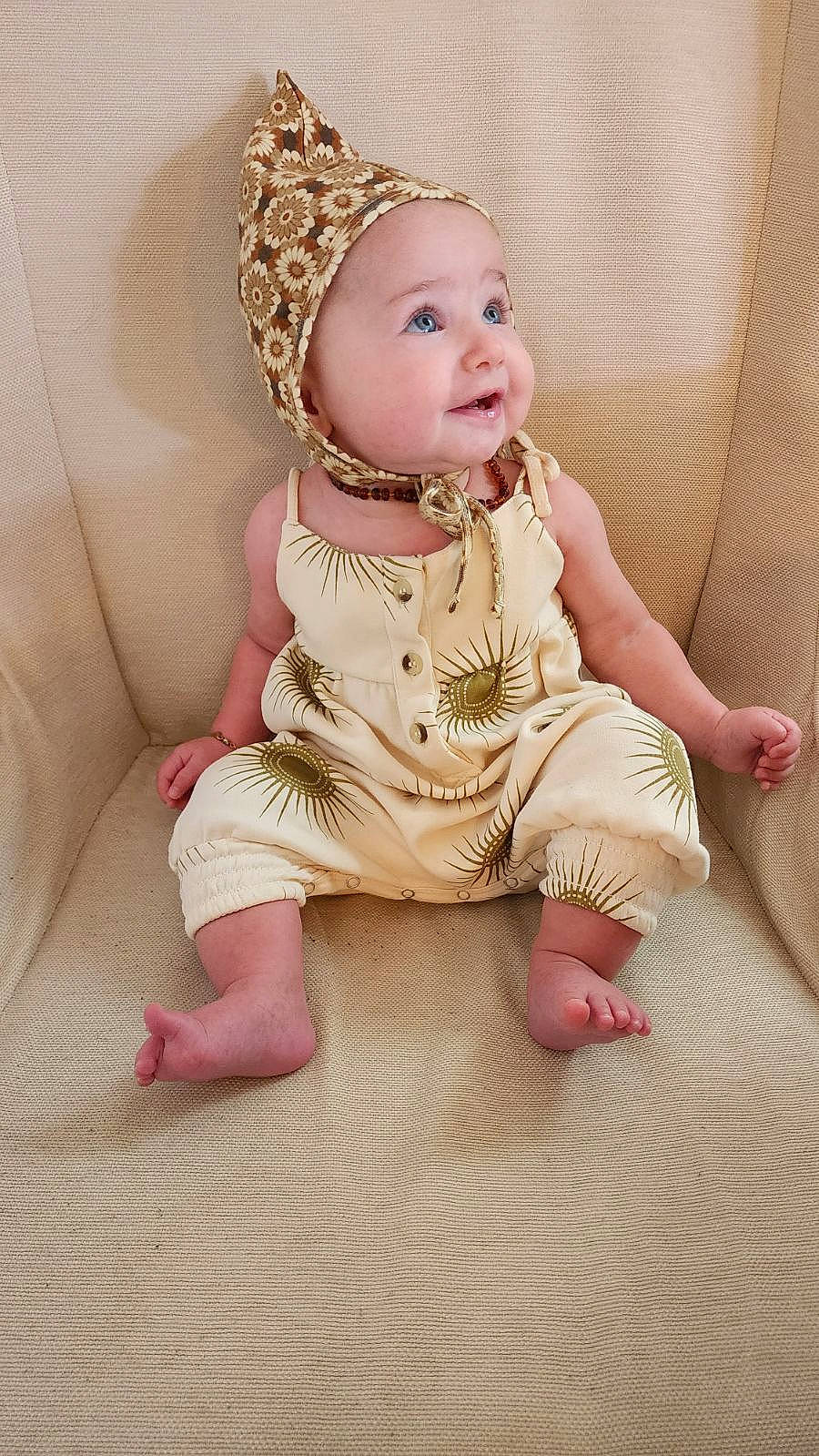 Adelina is registered to the contest to win money with this photo: baby, baby_toddler_clothing, cheek, child, collar, comfort, dress, eye, finger, flooring, happy, headband, headpiece, headwear, iris, jewellery, person, pink, skin, sleeve