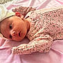 Hartleigh joined the competition — help win amazing prizes! baby, infant, headband, bow, pink, blanket, floral, clothing, laying_down, cute, newborn, child, soft_texture, portrait, skin, face, sleepwear, relaxing, indoors, peaceful