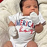 american_flag, baby, blanket, blue, booties, clothing, cute, face, indoor, infant, lying_down, mittens, newborn, onesie, patriotic, portrait, red, skin, soft_texture, white