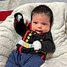 baby, infant, clothing, outfit, military_style, blanket, flag, american_flag, stars, red, white, blue, shoe, footwear, person, portrait, cute, indoor, soft, smile