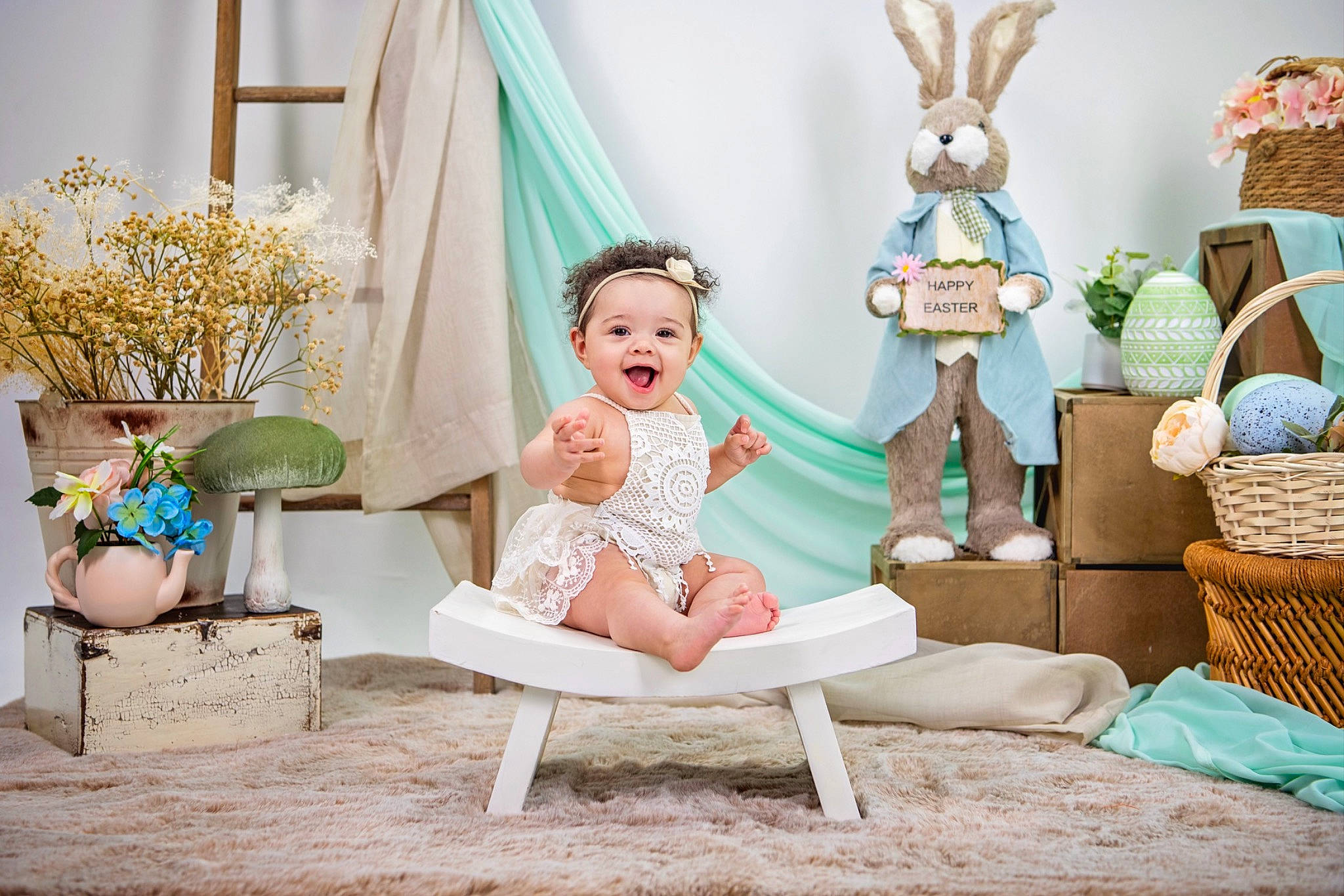 Rhea is registered to the contest to win money with this photo: aqua, azure, baby, blue, chair, child, comfort, couch, event, happy, hat, headpiece, headwear, people, person, picture_frame, pink, purple, room, sitting