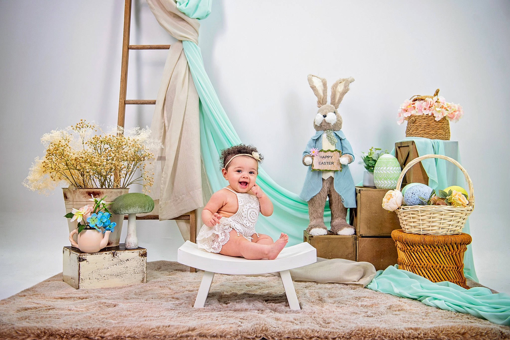 Rhea is registered to the contest to win money with this photo: aqua, azure, comfort, couch, doll, event, fashion_design, headwear, house, interior_design, leisure, linens, living_room, peach, person, pillow, room, sitting, textile, throw_pillow