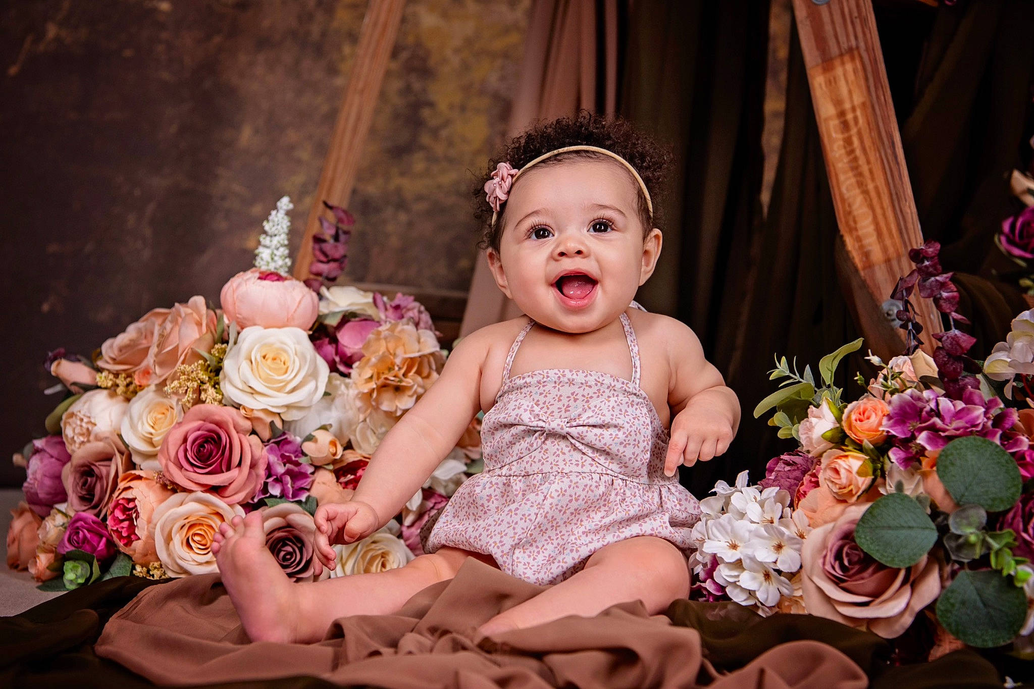 Rhea is registered to the contest to win money with this photo: baby, baby_toddler_clothing, curtain, dress, event, flash_photography, floral_design, flower, flower_arranging, fun, happy, headpiece, iris, person, pink, plant, rose, smile, toddler, toy