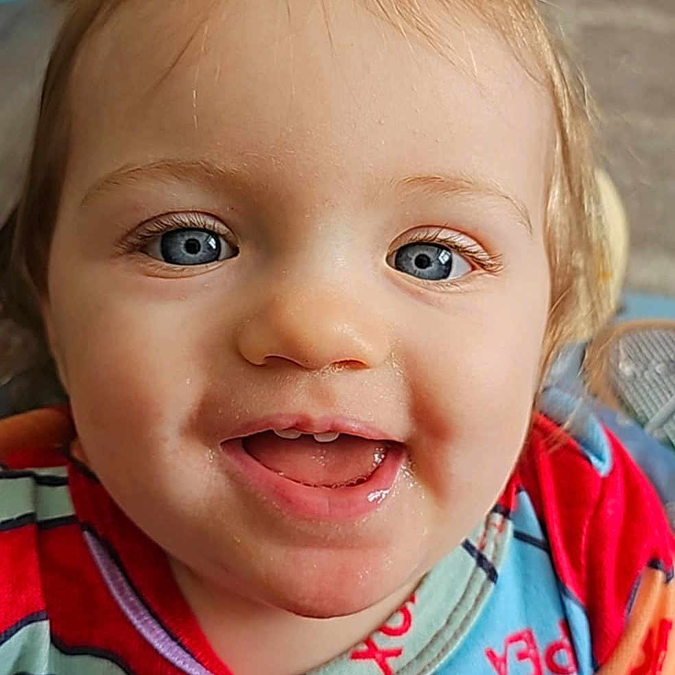 Sunny is registered to the contest to win money with this photo: accessories, baby, babylaughing, blonde, bodypart, dimples, face, hair, happy, head, headband, laughing, mouth, person, photography, portrait, smile, teeth
