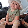 Stella joined the competition — help win amazing prizes! architecture, baby, building, cap, clothing, couch, face, furniture, hat, head, indoors, livingroom, person, photography, portrait, room, shorts, skin, t_shirt, tattoo
