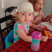 Stella joined the competition — help win amazing prizes! architecture, baby, building, cap, child, clothing, cutlery, diningroom, diningtable, face, furniture, hat, head, indoors, person, photography, portrait, room, spoon, table