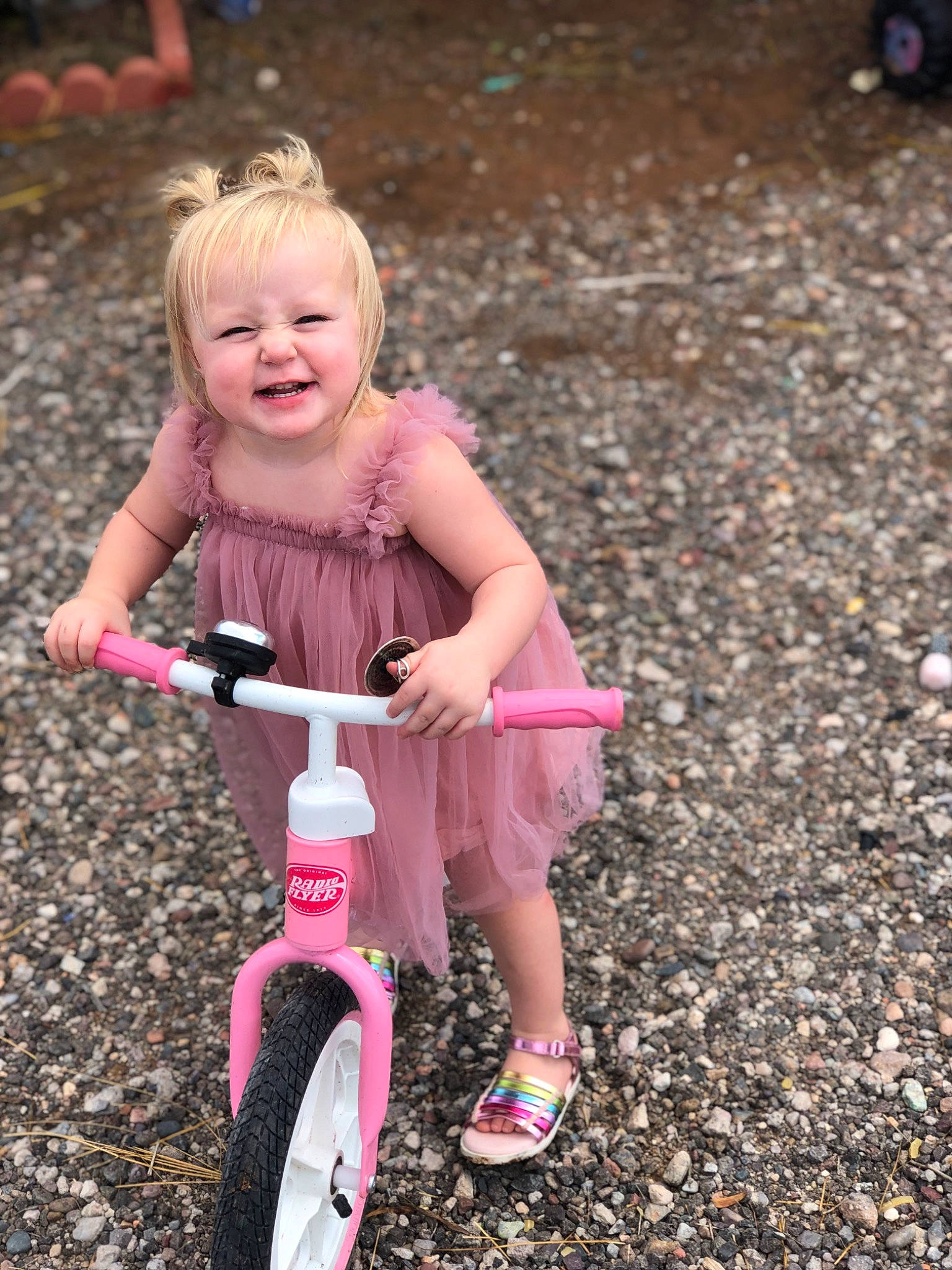 Bexlee joined the competition — help win amazing prizes! bicycle, bicycle_accessory, bicycle_frame, bicycle_handlebar, bicycle_tire, bicycle_wheel, bicycles_equipment_and_supplies, dress, face, grass, happy, leisure, outdoor_recreation, people_in_nature, person, pink, riding_toy, smile, tire, toddler