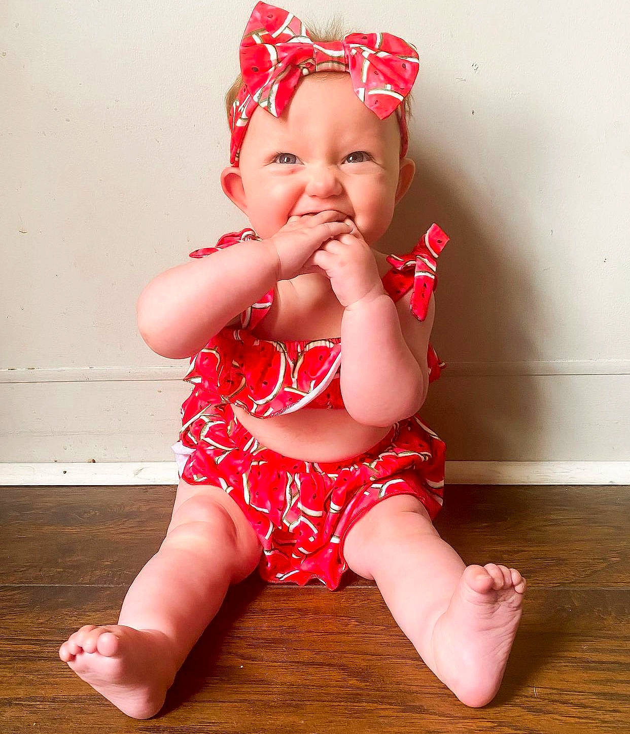 Kenleigh is registered to the contest to win money with this photo: baby, baby_toddler_clothing, elbow, eye, face, floor, flooring, happy, head, headwear, human_body, knee, lip, person, pink, red, skin, sleeve, smile, thigh