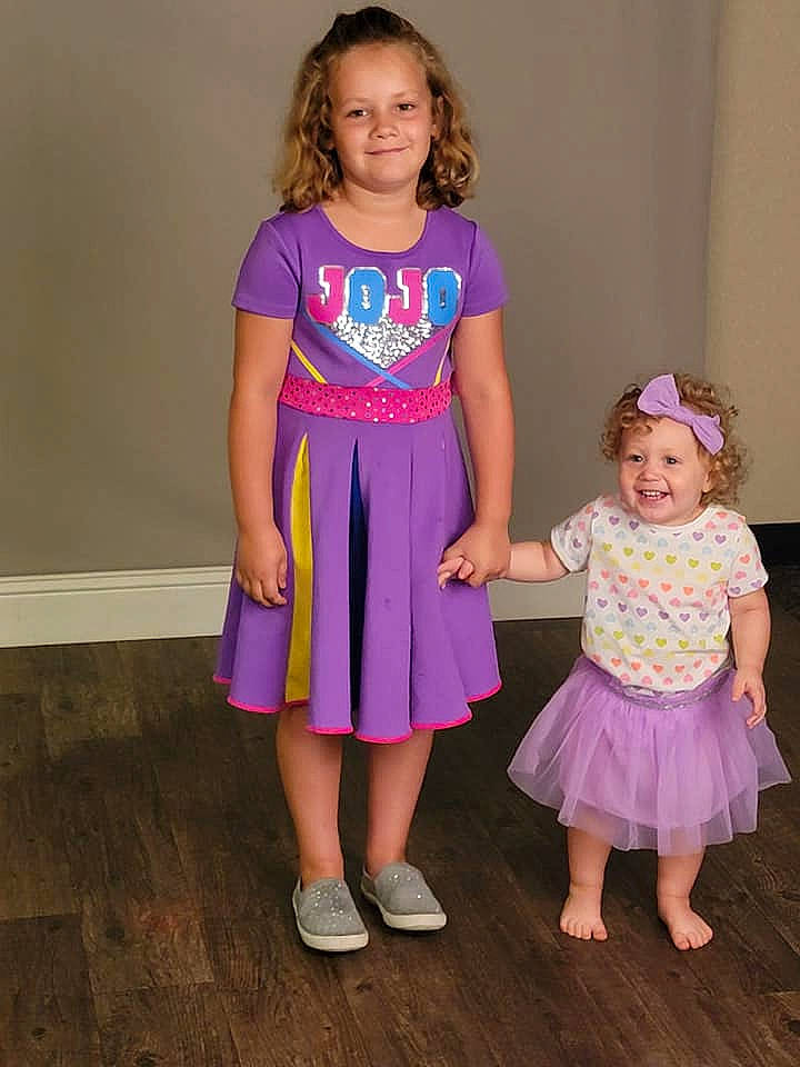 Dailyn joined the competition — help win amazing prizes! baby_toddler_clothing, clothing, day_dress, dress, face, facial_expression, fashion, fun, hairstyle, happy, head, joy, magenta, one_piece_garment, person, pink, purple, skin, sleeve, smile