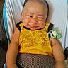 Jeron is registered to the contest to win money with this photo: adorable, baby, baby_seat, baby_toddler, child, clothing, comfort, cute, expression, face, happy, indoor, infant, joy, pacifier, person, seat, smiling, yellow_shirt, young_child