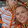 Kara joined the competition — help win amazing prizes! adult, cheerful, child, closeup, costume, face_paint, family, fashion, fun, happy, headband, indoor, orange, party, person, playful, portrait, smile, striped_shirt, tiger_ears